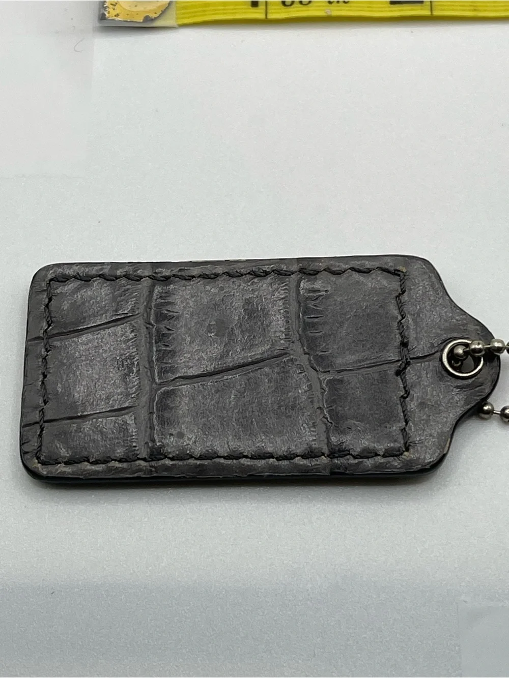 Coach Grey Crocodile Embossed Hang Tag